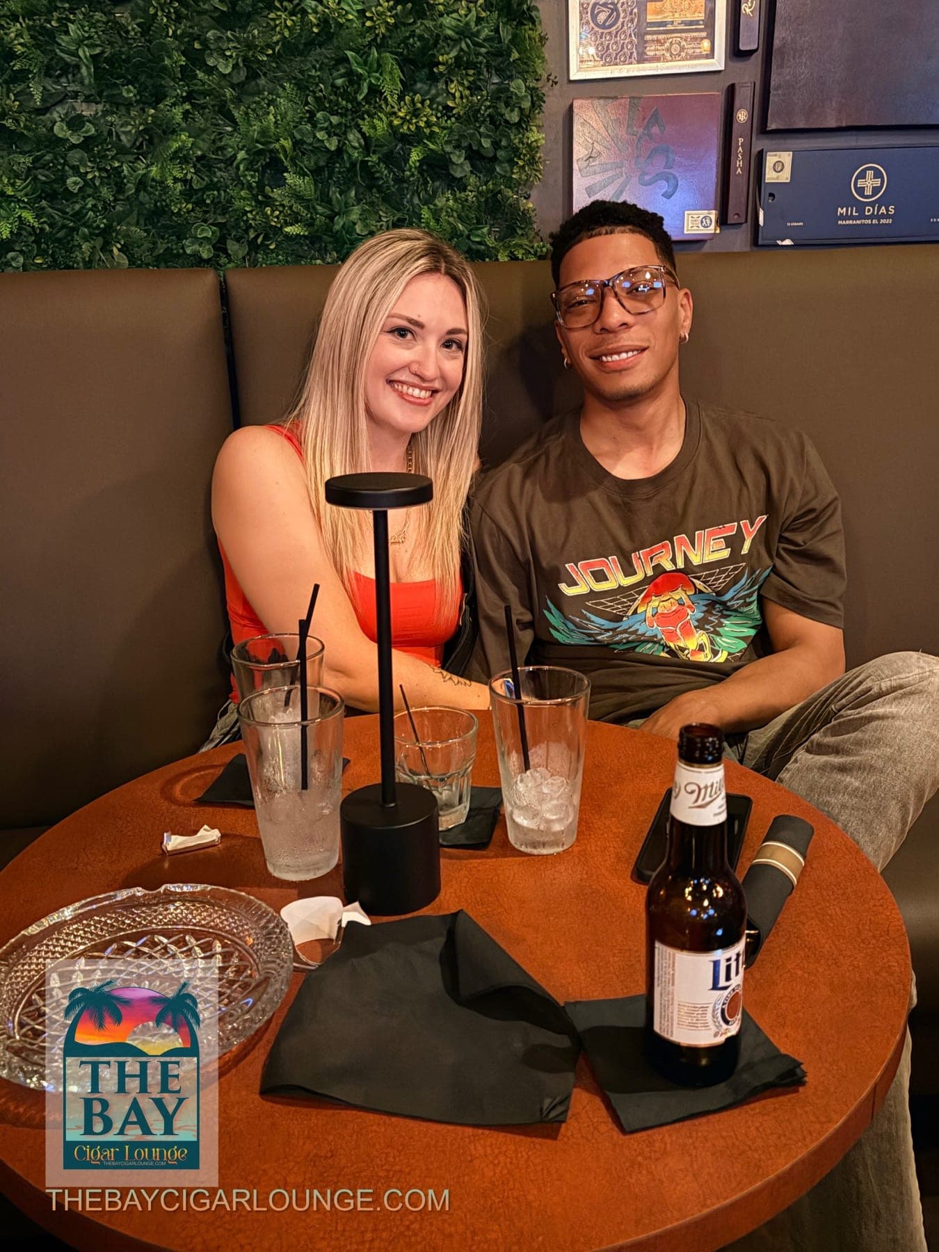 Two guests seated together at a table inside The Bay